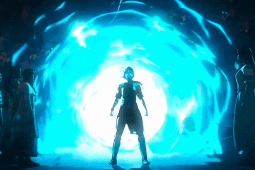 a woman stands in front of a blue light
