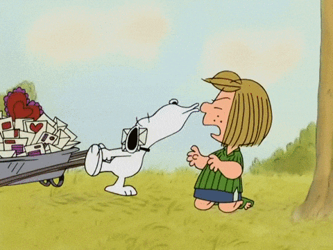 a cartoon of snoopy pushing a wheelbarrow full of mail