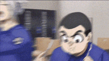 a blurry picture of a man in a blue shirt holding a knife .