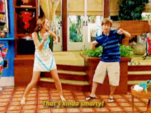 a man and a woman are dancing in a living room with the words that 's kinda smarty behind them