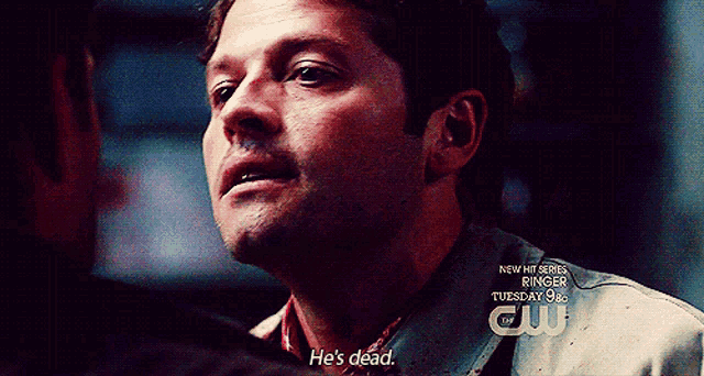 a close up of a man 's face with the words he 's dead