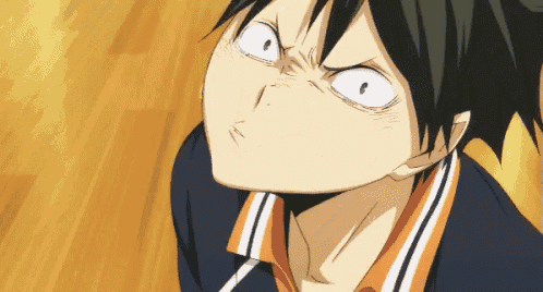 a close up of a person making a face with their eyes closed