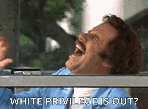 a man is laughing with the words " white privilege is out " behind him