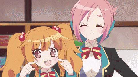 a couple of anime girls are standing next to each other and one of them is pointing at the camera