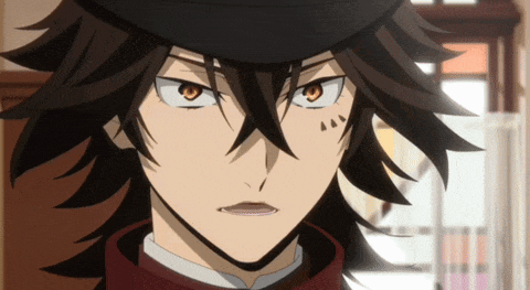 a close up of a person 's face with a black hat on