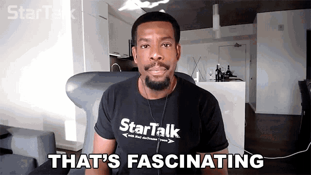 a man wearing a black shirt that says startalk on it