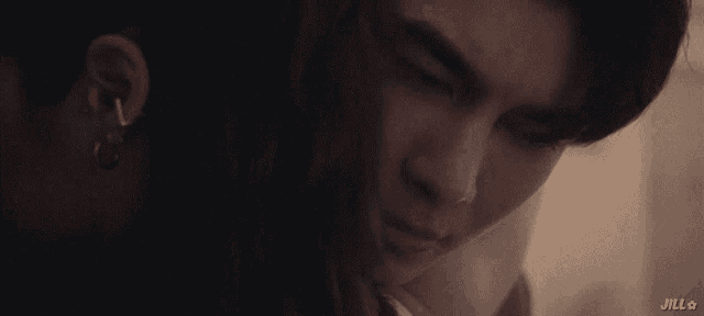 a close up of a person 's face with jill written below it