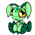 a green cartoon character is crying and sitting down