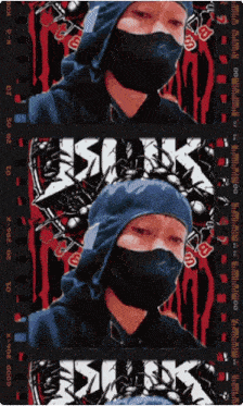 a man wearing a mask and a blue hoodie with the word kuk on it