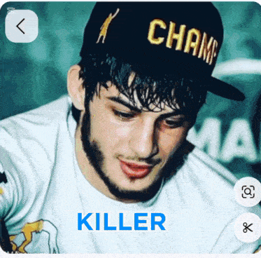 a man wearing a hat that says ' champ killer ' on it