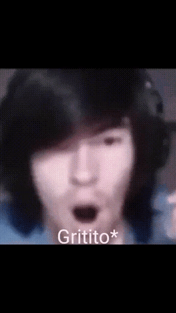 a close up of a person 's face with the word gritito on the bottom left