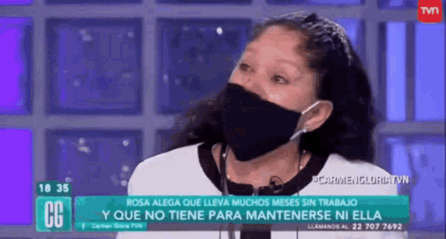 a woman wearing a face mask is on tv