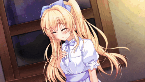 a girl with blonde hair and a blue bow in her hair is smiling