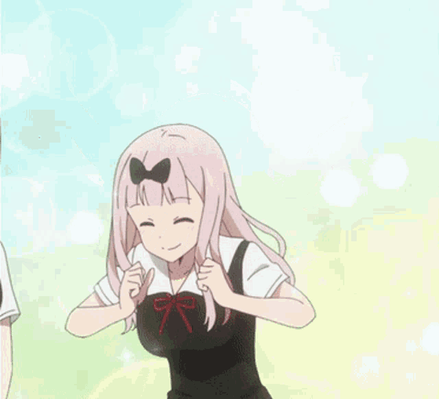 a girl with pink hair and a bow on her head is standing with her arms outstretched