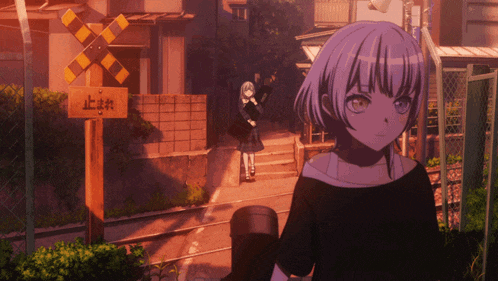 a girl is standing in front of a sign that says " stop "