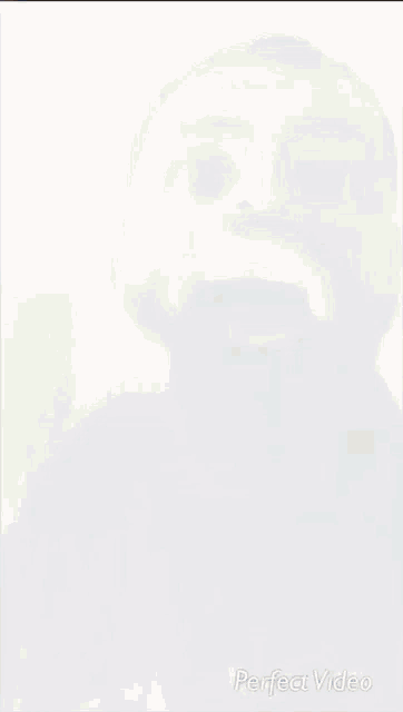 a man with a beard is making a funny face in a perfect video .