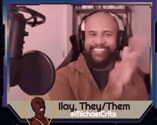 a man wearing headphones is smiling in front of a microphone with the words " ilay they them " on the bottom