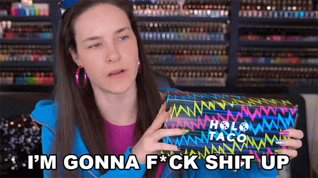 a woman holding a box that says i 'm gonna fuck shit up