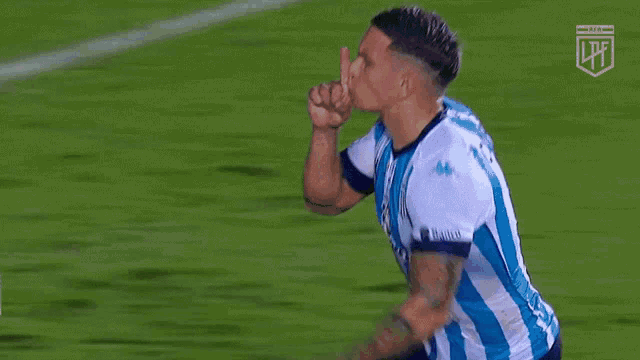 a soccer player wearing a blue and white striped jersey with aerosef on the front