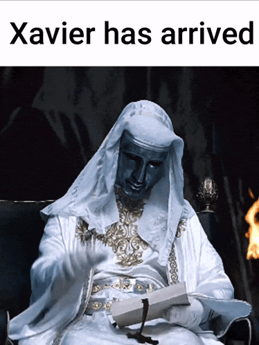 a picture of a man in a white robe with the words xavier has arrived above him