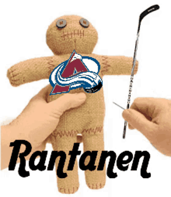 a person is holding a stuffed gingerbread man with a hockey stick and the name rantanen on the bottom