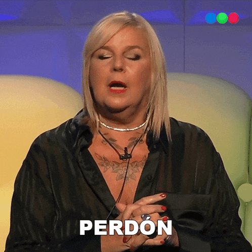 a woman in a black shirt with the word perdon on the bottom