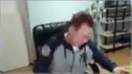 a blurry picture of a man in a chair