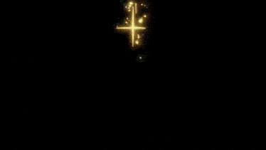 a blue and yellow light beam is coming out of the center of a galaxy .