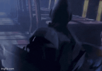 a blurry picture of a person in a dark room with the words imgflip.com on the bottom
