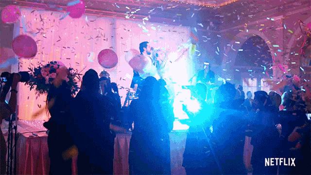a group of people are dancing in a room with a netflix logo on the bottom