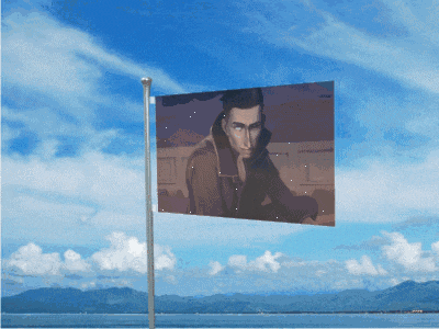 a flag with a picture of a man on it flying in the wind