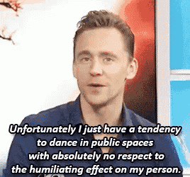 a man in a blue shirt is talking about his tendency to dance in public spaces .