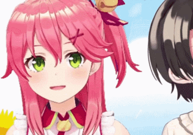 a girl with pink hair and green eyes is standing next to a boy with black hair .
