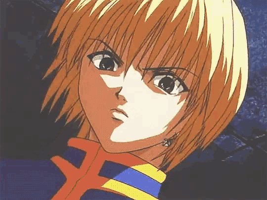 a close up of a person 's face with a blue and yellow shirt