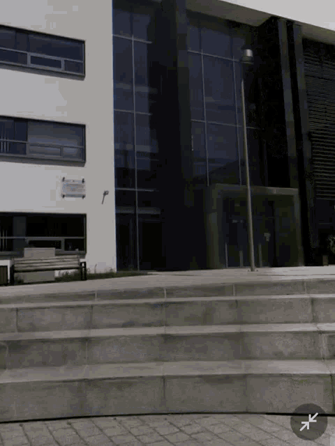 a white building with a sign on the side that says ' a '