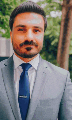 a man with a beard is wearing a suit and tie with a name tag that says ' brian ' on it