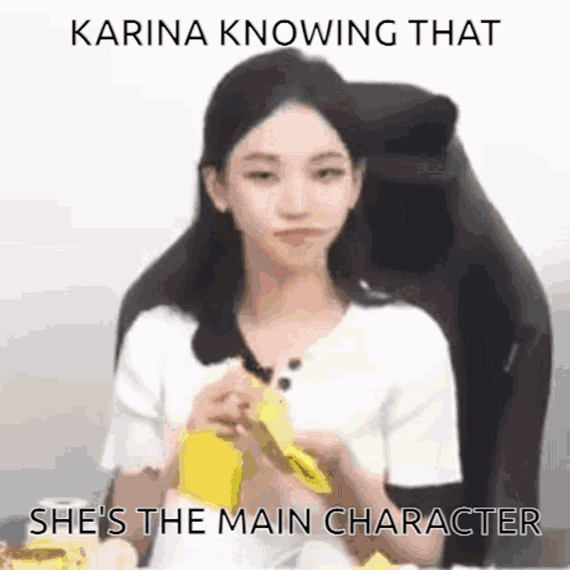 a woman is sitting in a chair with the words `` karina knowing that she 's the main character '' written below her .