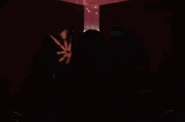 a woman is standing in front of a crowd of people