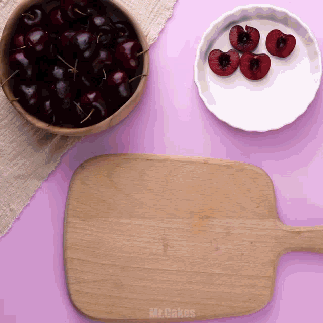 a wooden cutting board with mr.cakes written on the bottom