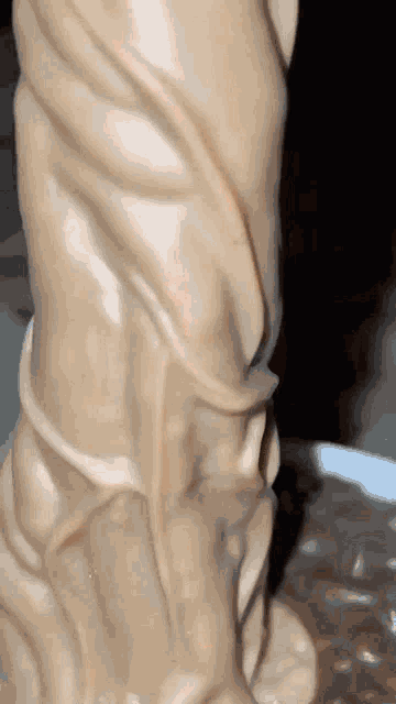 a close up of a statue with a swirl in it