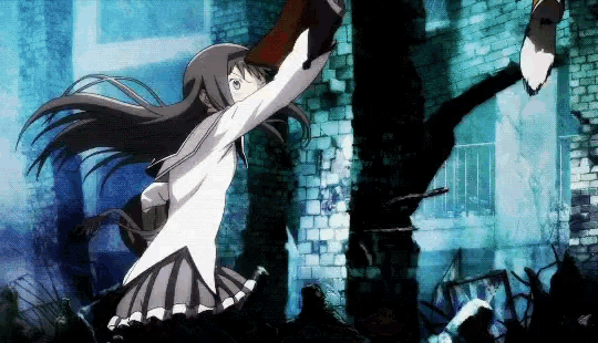 a girl in a school uniform is standing in front of a brick wall holding a bottle .