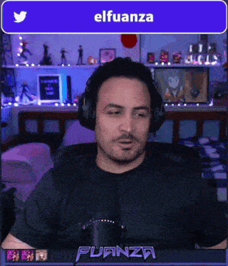 a man wearing headphones is sitting in front of a microphone with a twitter icon above him
