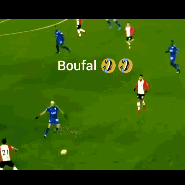 a soccer player with the number 28 on his jersey kicks a ball