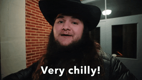 a man wearing a cowboy hat says very chilly