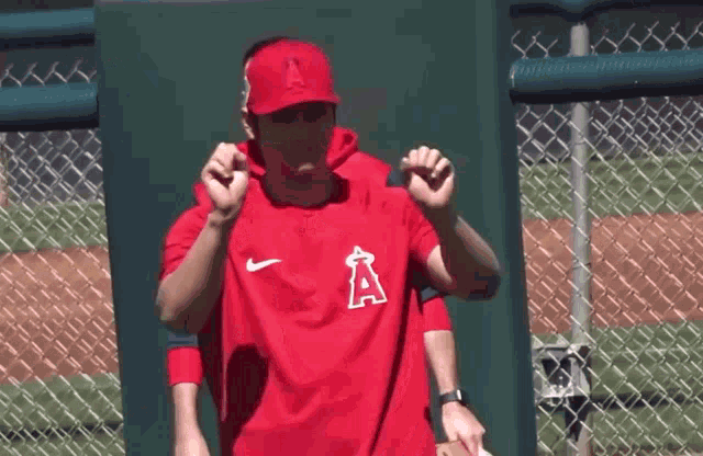 a man in a red shirt with the letter a on the front