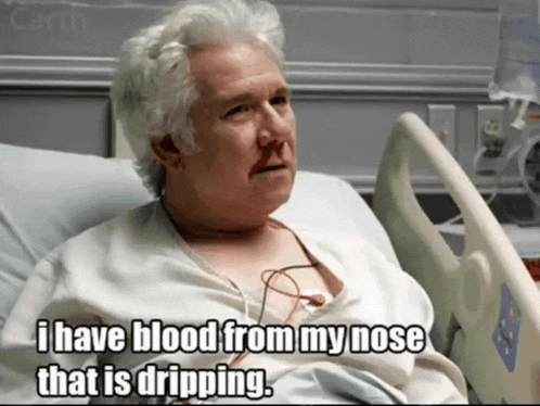 a man in a hospital bed with a caption that says i have blood from my nose that is dripping