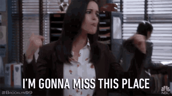 a woman is dancing in an office and saying i 'm gonna miss this place
