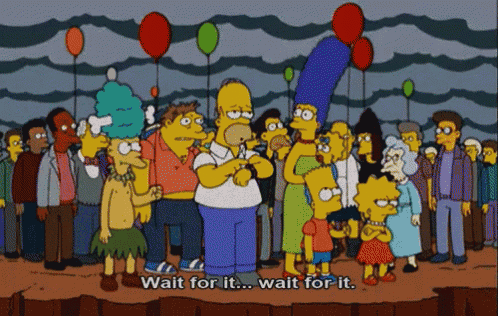 a cartoon of homer simpson holding balloons with the words wait for it
