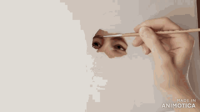 a painting of a woman 's face is being made in animatica