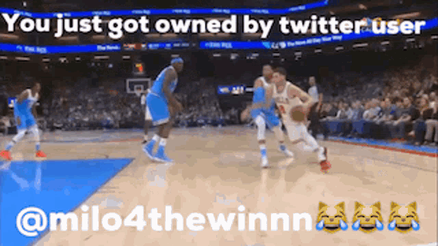a basketball game is being played on a court with a caption that says you just got owned by twitter user